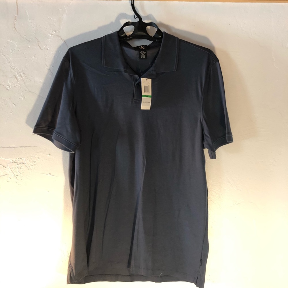 Calvin Klein size L shortsleeve collared with tags